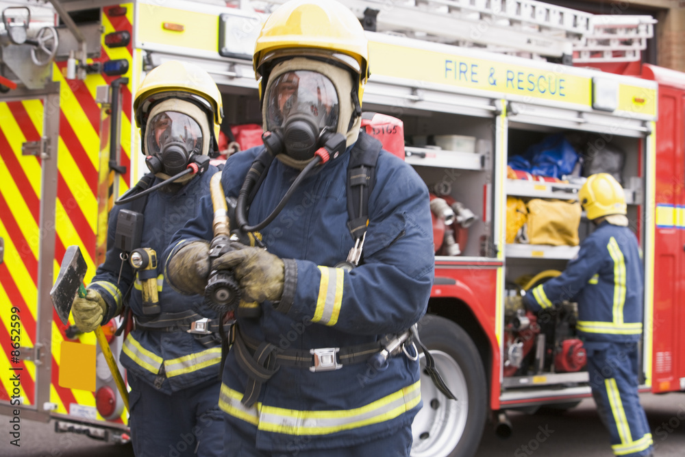 Firefighters in protective workwear Firefighters in protective workwear