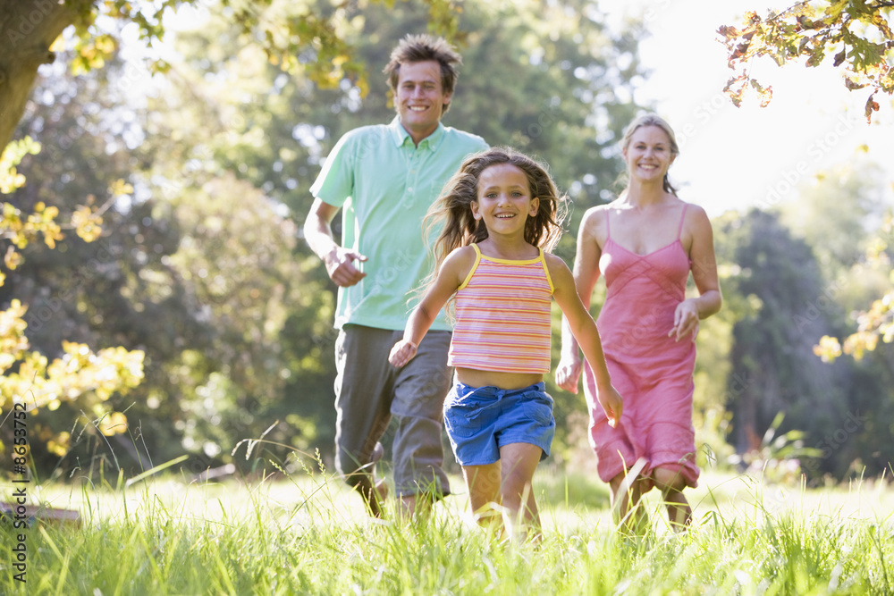 Fototapeta premium Family running outdoors smiling