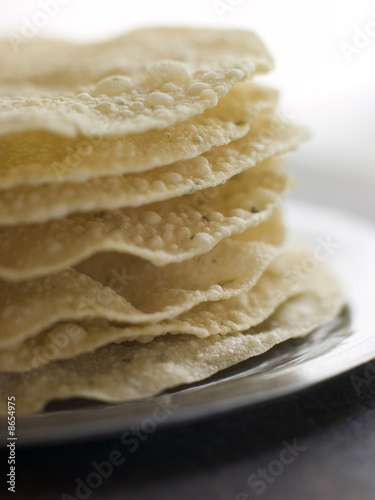 Stack of cooked Papadoms photo