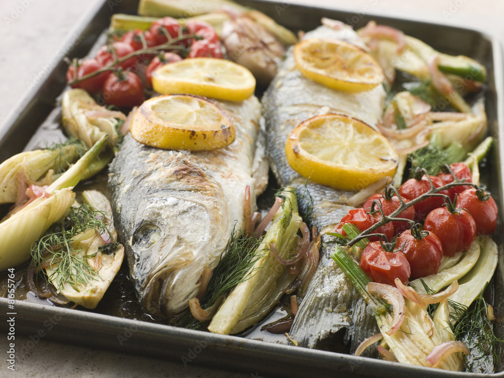 Whole Sea Bass Roasted with Fennel Lemon Garlic and Cherry Tomat Whole Sea Bass Roasted with Fennel Lemon Garlic and Cherry Tomat