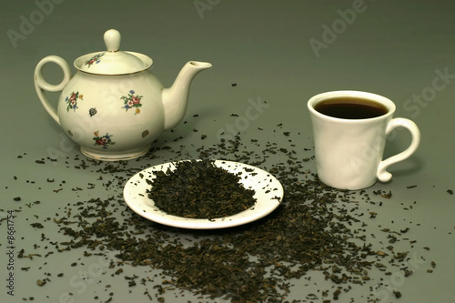 teapot and teacup with dry tea