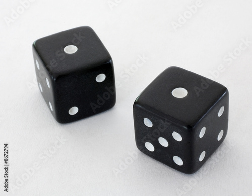 snake eyes rolled on a pair of black dice on a white background