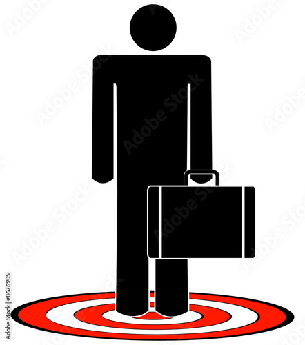 business man with briefcase standing on target