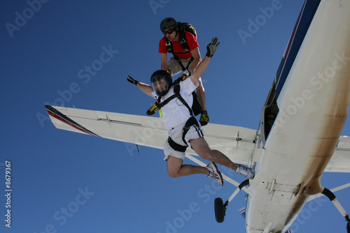 Fototapeta Naklejka Na Ścianę i Meble -  Two Skydivers exit an airplane