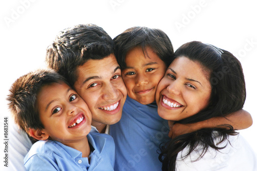 Happy Family Embracing & Laughing Together Outdoors