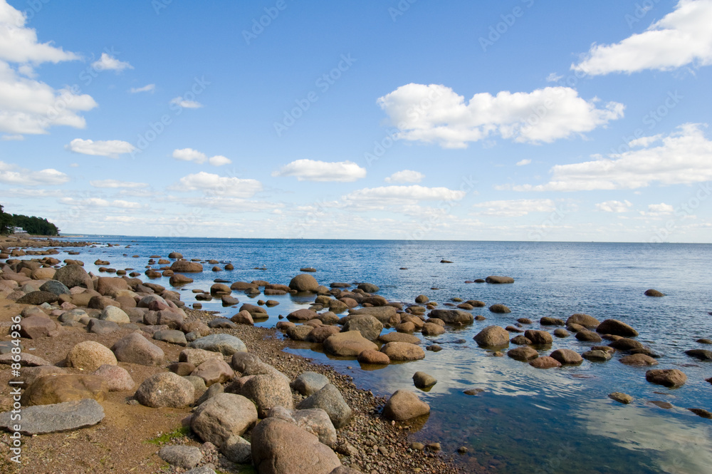 White clouds on blue sky. Sea. White clouds on blue sky. Sea.