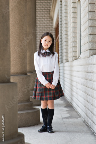 elementary schoolgirl in school uniform
