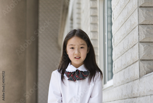 elementary schoolgirl in school uniform