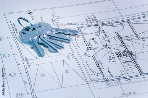 blue tone image of keys over some technical drawing