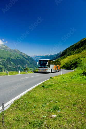 Bus on a road in Alps