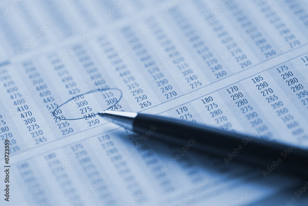 Pen on financial figures.