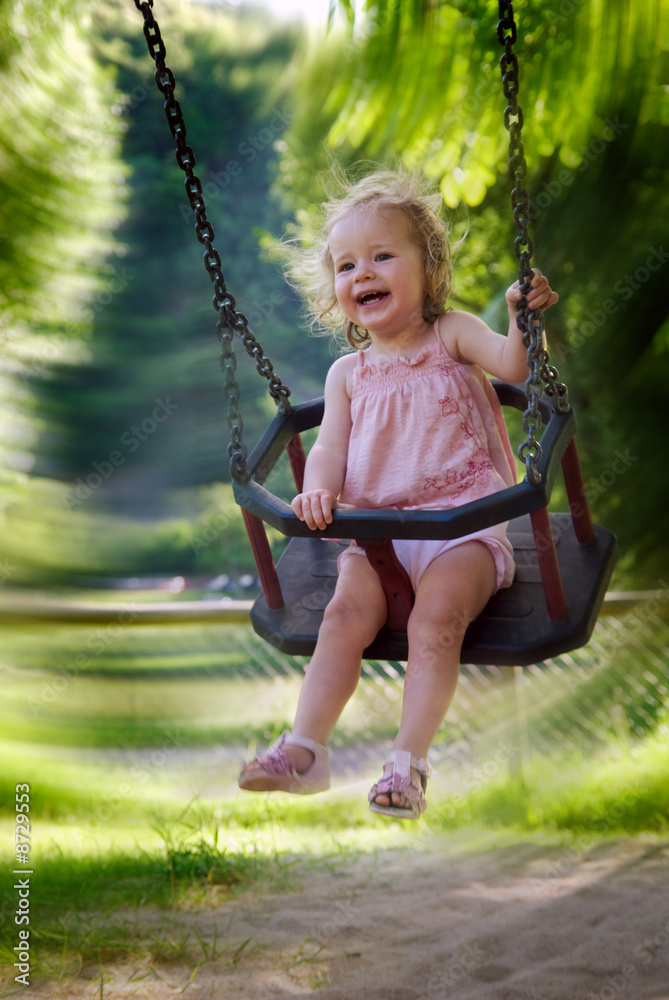 girl having fun on a swing