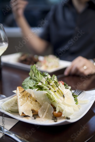 Appetizer salad with shaved parmesan cheese