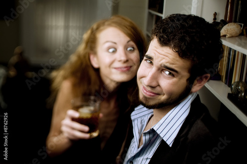 Woman Leers at Man at Party