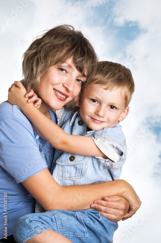 Portrait of cute young boy and his mother