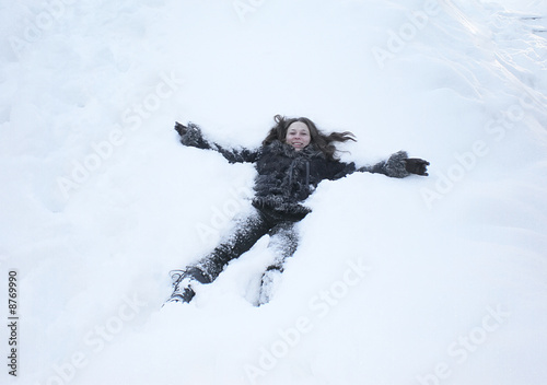 young girl having fun in snow