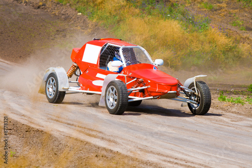 Red racing buggy on track