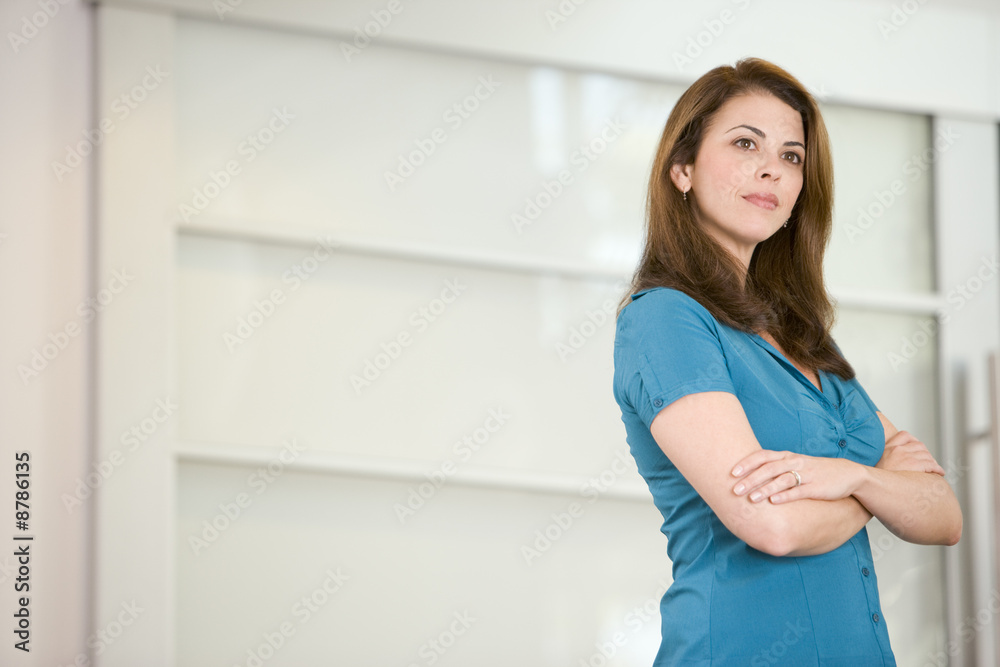 Businesswoman standing indoors Businesswoman standing indoors
