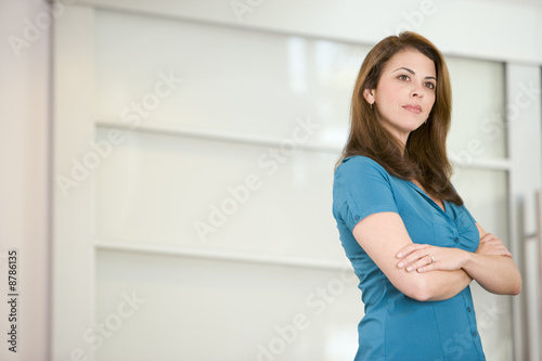 Free Download Businesswoman standing indoors - GFXLoad