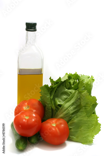 olive oil with green salad and tomatoes
