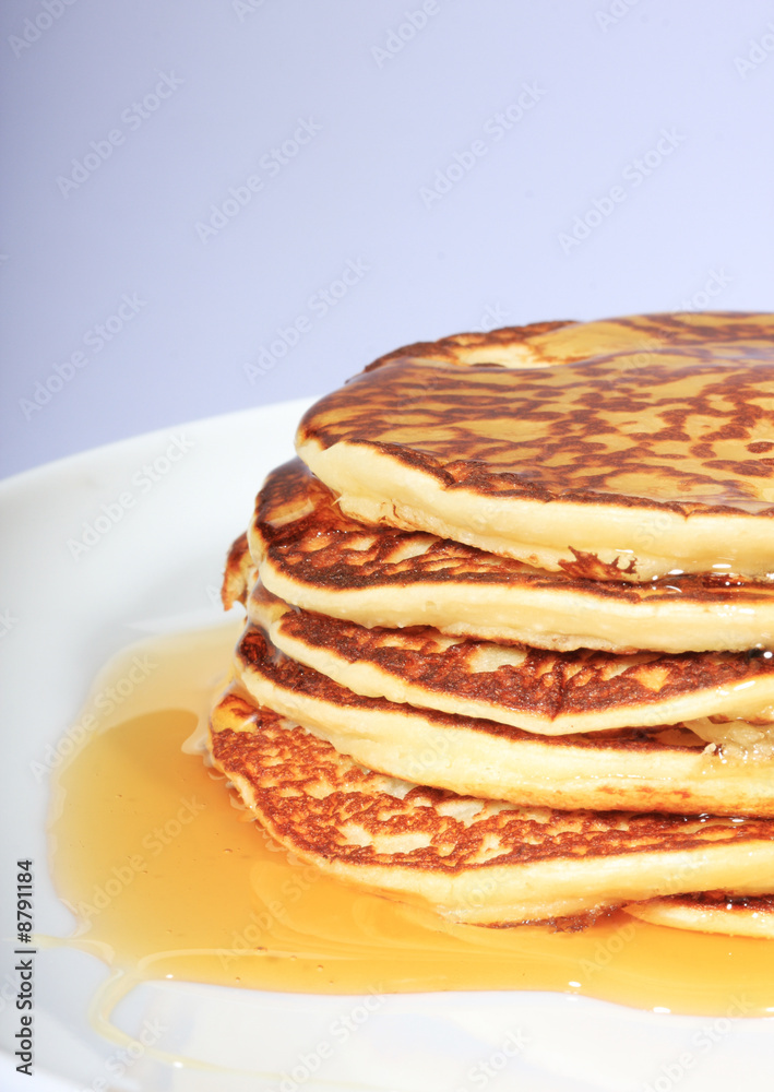 pile of american pancakes with syrup