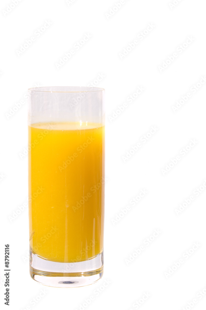 Fresh squeesed orange juice in a glass bathed in sunshine and po Fresh squeesed orange juice in a glass bathed in sunshine and po