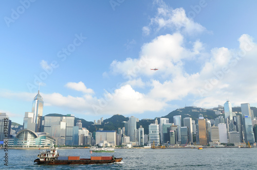 Hong Kong skyline with cargo container, ferry and helicopter