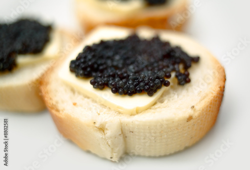 Black caviar on a slice of bread and butter
