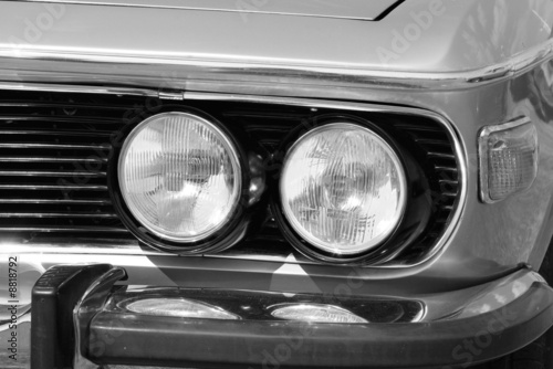 two headlight in black and white american vintage car