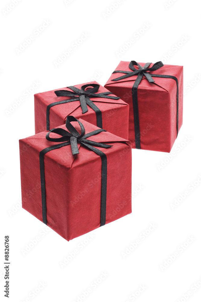 Three red gift boxes with black bows and ribbons Three red gift boxes with black bows and ribbons