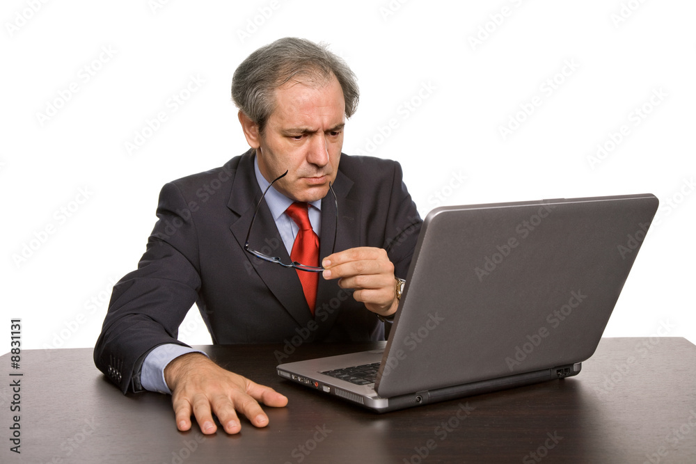 mature business man working with his laptop mature business man working with his laptop