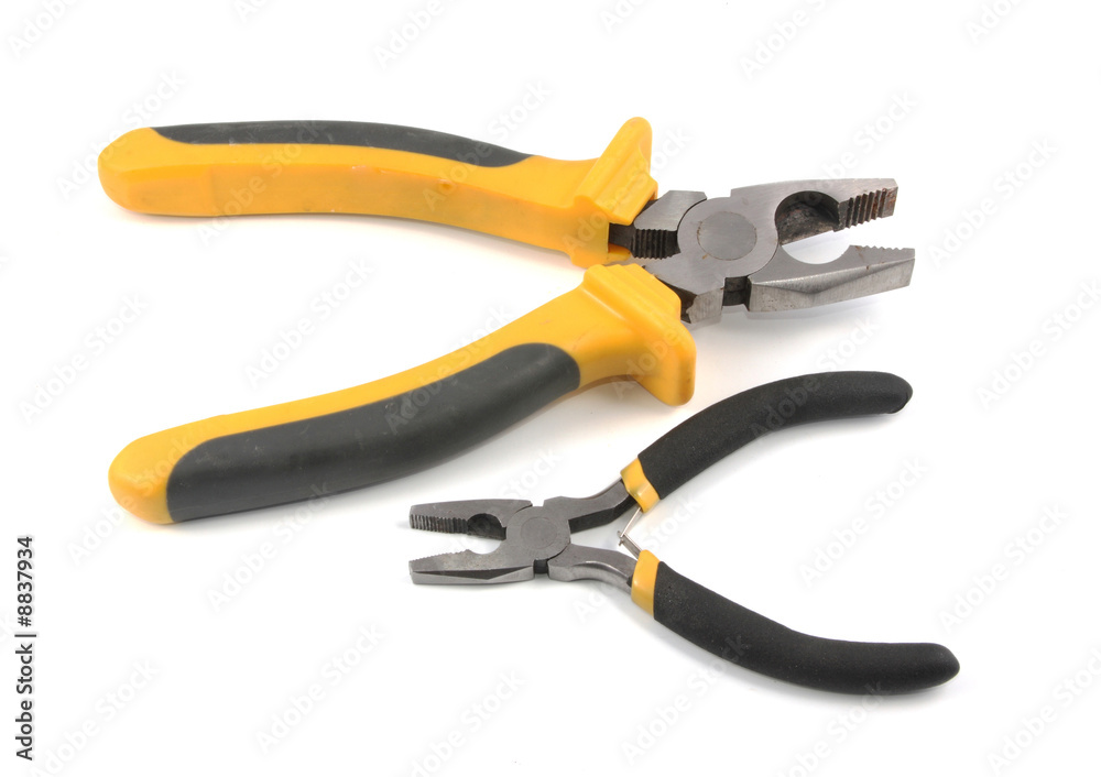The big and small flat-nose pliers lay on a white background. The big and small flat-nose pliers lay on a white background.
