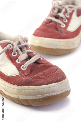 An old worn pair of children's shoes.