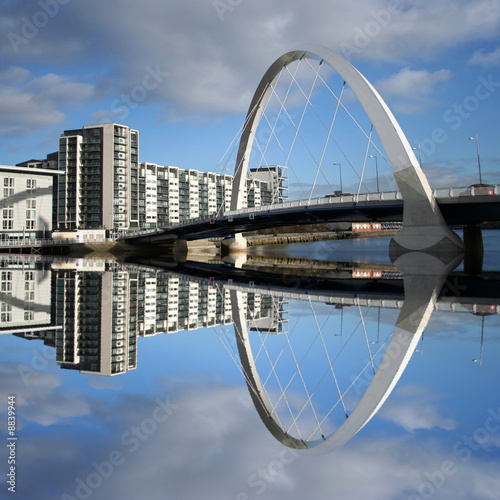 new bridge reflected in river Clyde Glasgow Scotland photo