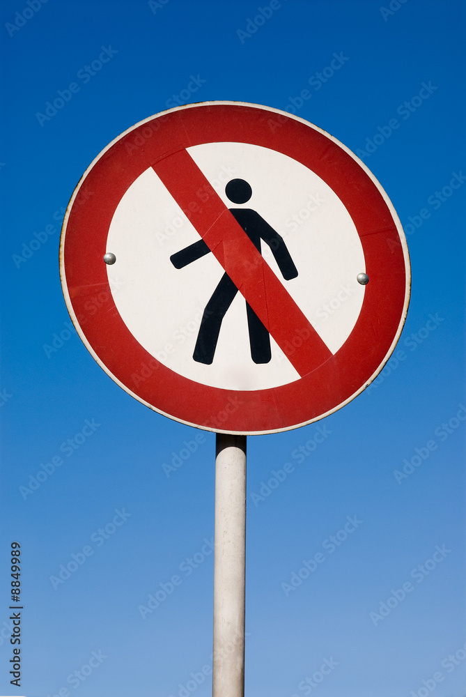 No Walking Sign against blue sky No Walking Sign against blue sky