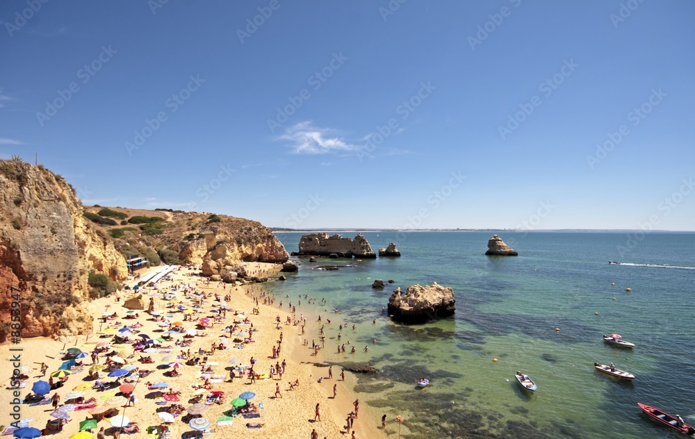 Obraz premium Tourism near Lagos in the Algarve in Portugal in summertime