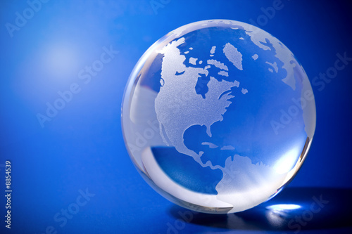 Backlit blue globe with copyspace