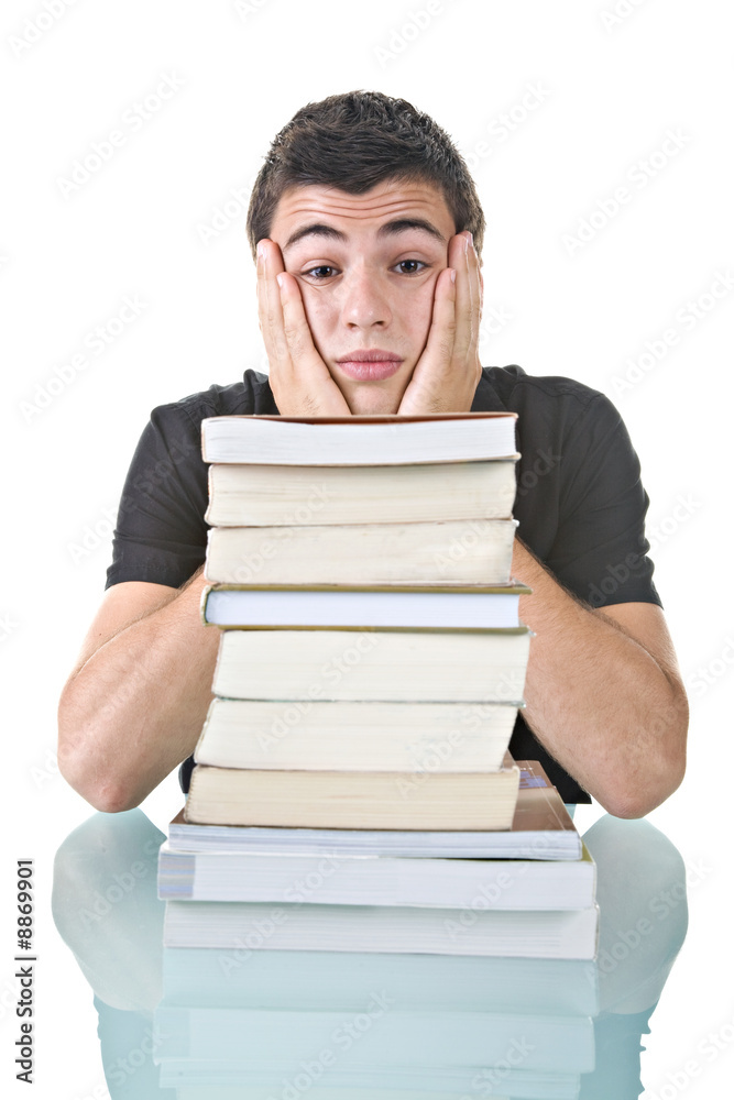 Stressed young student with a pile of books to read. Stressed young student with a pile of books to read.
