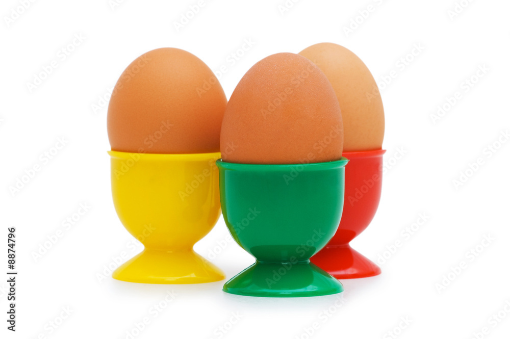 Brown egg in holder isolated on white Brown egg in holder isolated on white