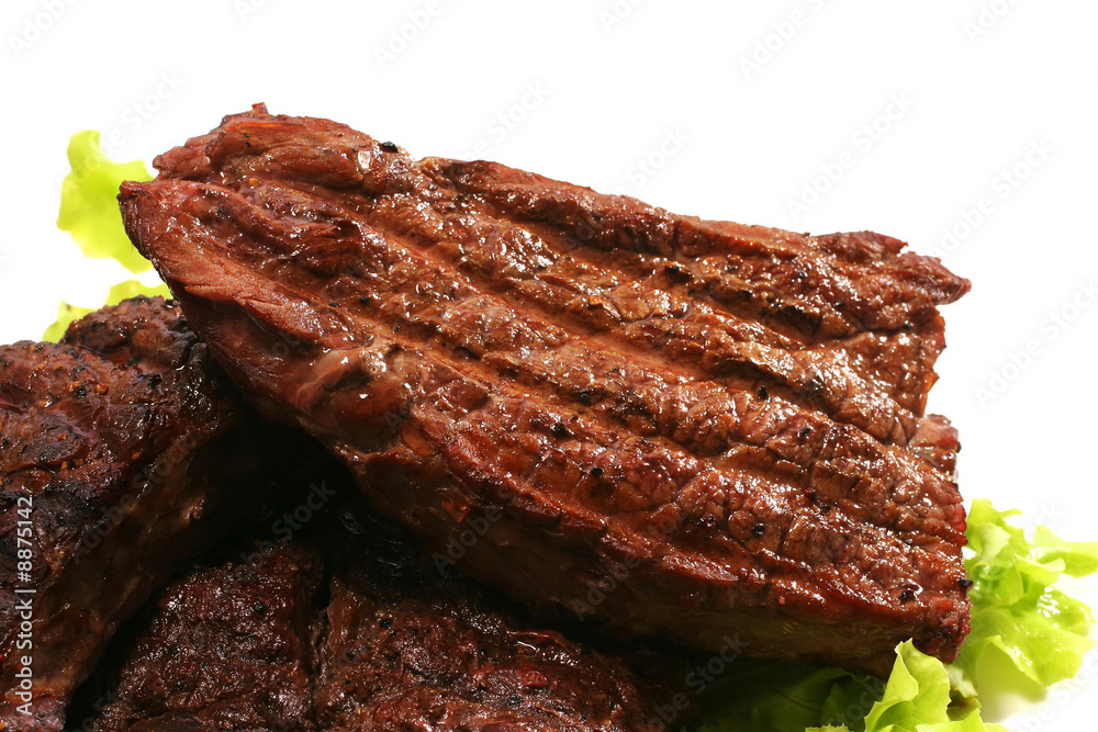beef meat and green salad over white