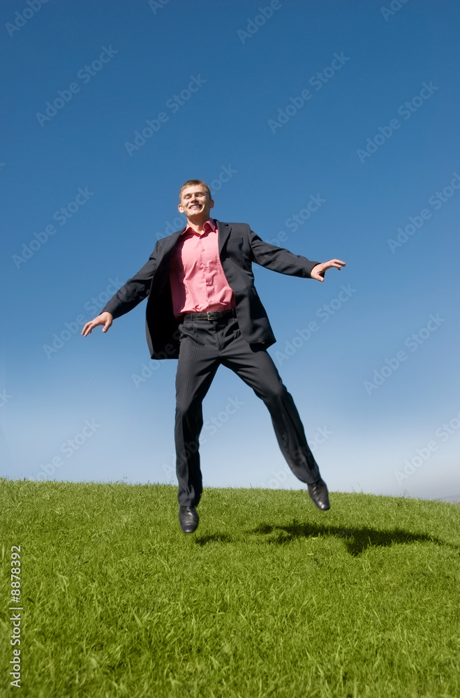 young successful businessman flies up