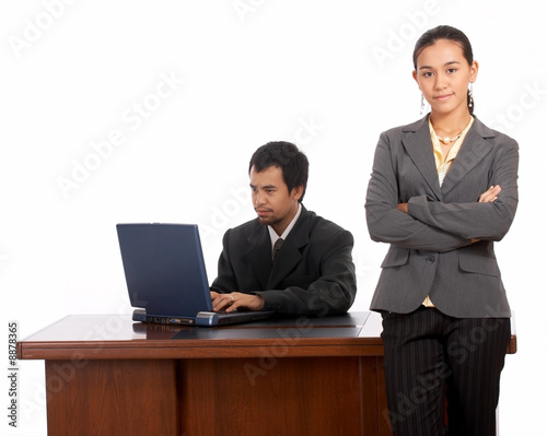 portrait of beautiful secretary standing infront of her boss