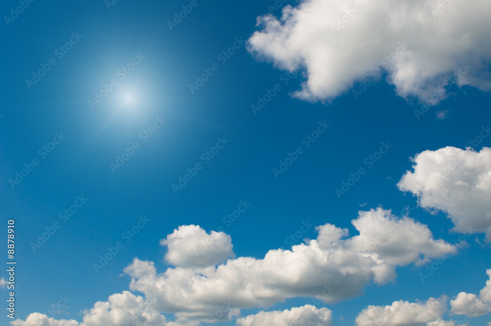 Obraz premium white clouds over deep blue sky background