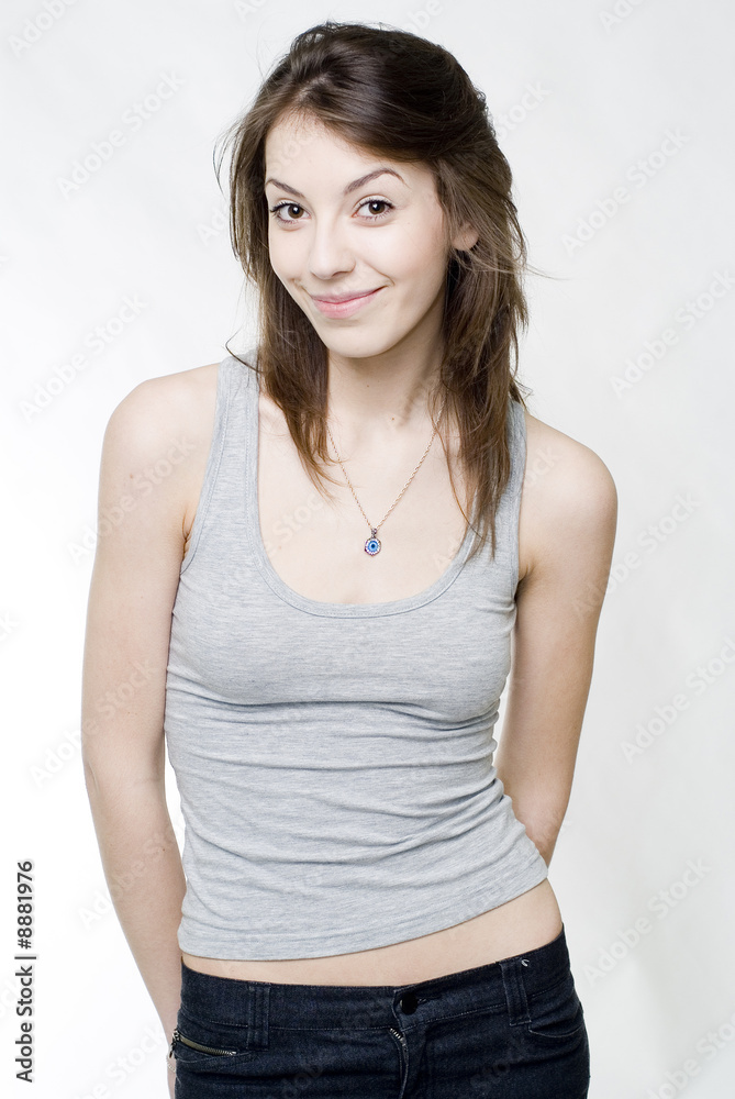 Young graceful smiling brunette studio shot Young graceful smiling brunette studio shot