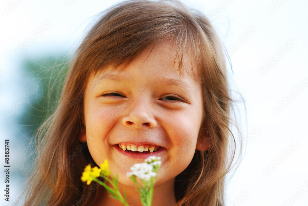 Little cute girl with flower outdoors Little cute girl with flower outdoors