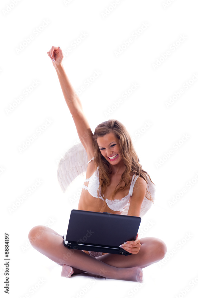 Sign win. Young angel on a laptop Sign win. Young angel on a laptop