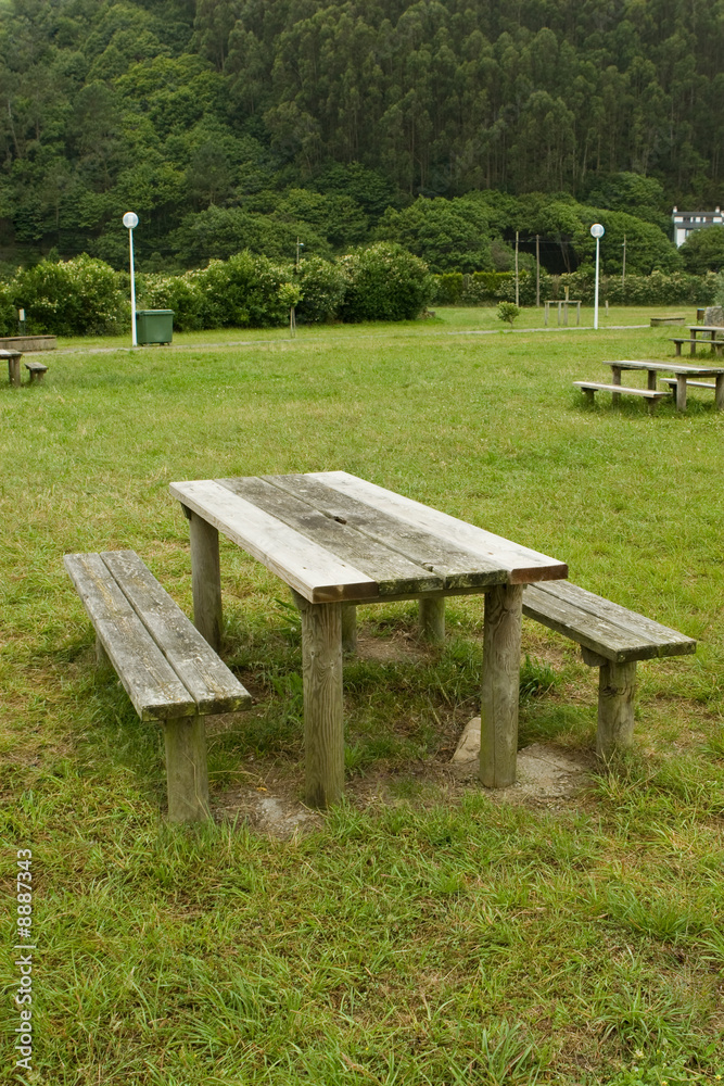 weathered picnic table and seats by the forest weathered picnic table and seats by the forest