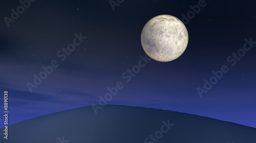 A night full moon over a sand dune. © Dan Collier