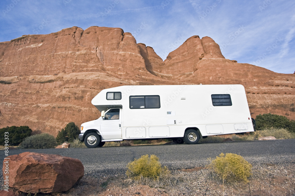 RV in front of red rocks - Utah.