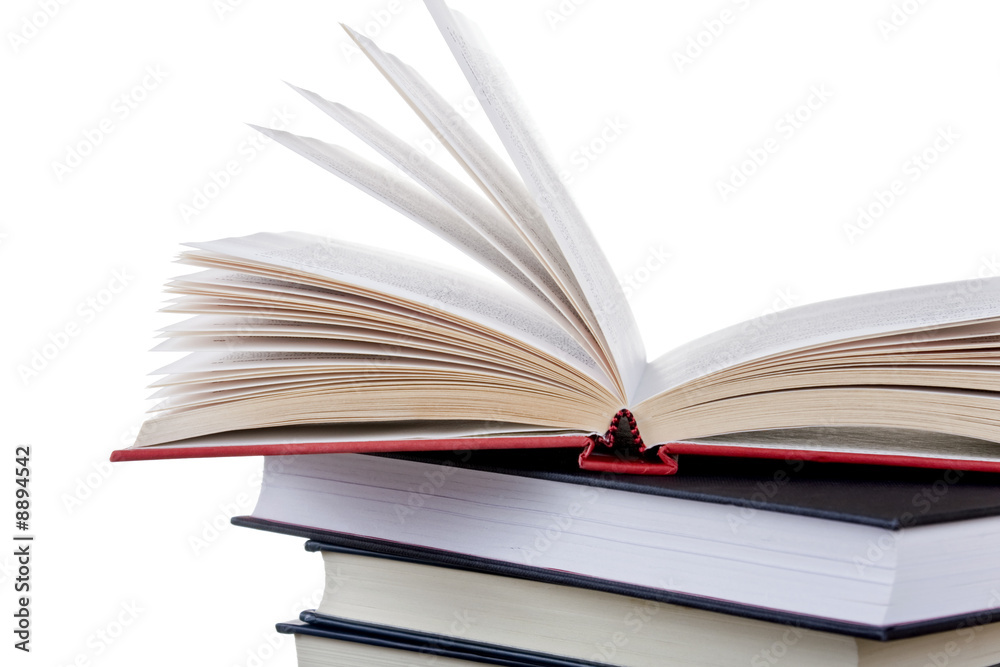 Stack of books with one left open